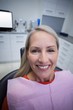 © WavebreakMediaMicro - Female patient sitting on dentist chair