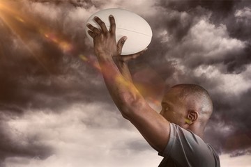 Poster - Composite image of athlete throwing rugby ball 3D