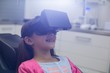 © WavebreakMediaMicro - Girl using virtual reality headset during a dental visit