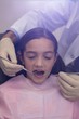 © WavebreakMediaMicro - Dentist examining a young patient with tools