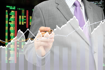 Fototapete - Businessman analyzing financial chart
