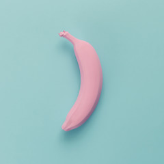 Poster - Pink banana on blue pastel background. Minimal style. Flat lay.