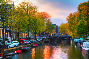 Wall Mural - Amsterdam city view with canals and bridges