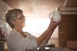 © WavebreakMediaMicro - Female potter checking jug