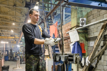 Worker braids end of the steel wire rope slings.