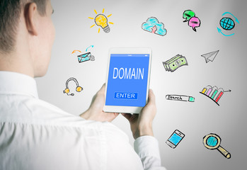 Wall Mural - Domain concept. Man holding a tablet computer