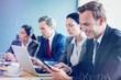 © vectorfusionart - Businesspeople in conference room