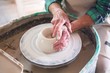 © WavebreakMediaMicro - Mid section of potter making pot