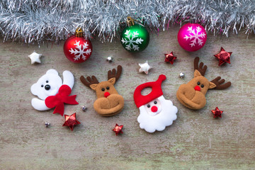 Santa claus and snowman with Christmas decoration on wood backgr