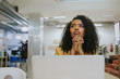 © ADDICTIVE STOCK - Thoughtful woman sitting at her laptop