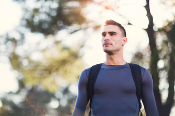 Wall Mural - Handsome man exercising in forest