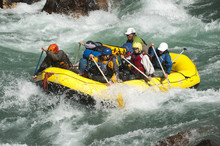 Rafters Get Splashed As They Go Through Some Big Rapids On The Karnali River, West Nepal