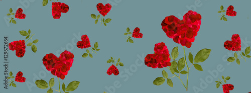 red heart rose petals on a stalk of green leaves