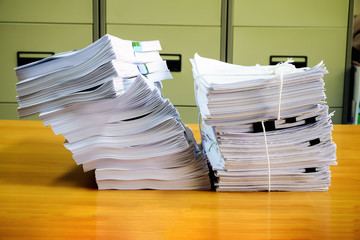 Pile of unfinished documents on office desk, Stack of business p