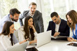 © BGStock72 - Young business people keeping team building in a modern office