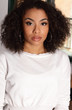 Attractive African American girl portrait in white sweater