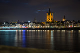 Fototapeta Krajobraz - Cologne Cathedral and Hohenzollern Bridge at sunset / nighttime