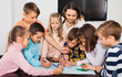 © JackF - Children with teacher drawing together in classroom
