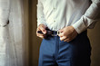 © bondvit - man putting on a belt, Businessman, Politician, man's style, male hands closeup, American businessman, European businessman, a businessman from Asia, People, business, fashion and clothing concept