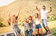 © Mirko Vitali - Group of happy friends having fun at countryside party ride on pick up truck car - Friendship concept with young people sharing time together on farmhouse picnic - Soft warm desaturated green filter