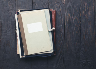 Wall Mural - stack of folders on wooden background