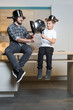 © Myvisuals - Father and son having fun in kitchen playing with pots