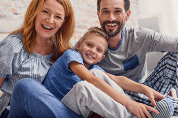 Happy family relaxing at home