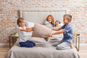 Wall Mural - Young family being playful at home