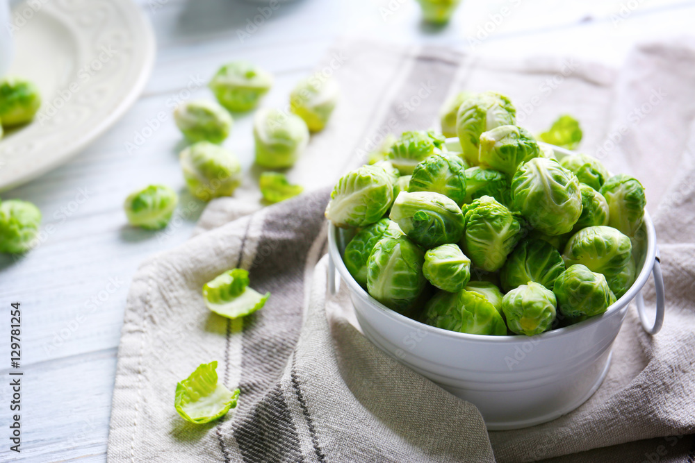 Brussels sprouts in small decorative bucket on napkin