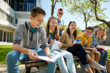 Canvas Print - group of students with notebooks at school yard