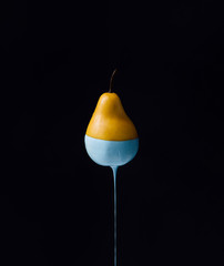Wall Mural - pear with dripping blue paint. minimal food concept.