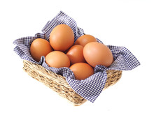 Eggs In Basket Isolated On White Background