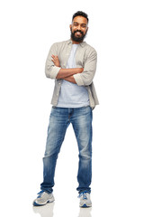 Wall Mural - happy smiling indian man over white