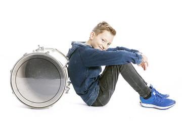 teenage boy and drum on floor of studio