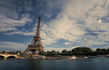 Eiffel Tower. Paris. France. Famous historical landmark on the quay of a river Seine. Romantic, tourist, architecture symbol. Toned