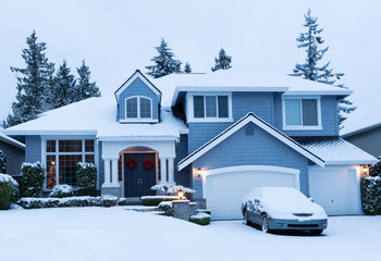 Home decorated for the winter holidays with fresh snow