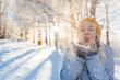 © Myvisuals - Young woman blowing snowflakes from hands. Selective focus
