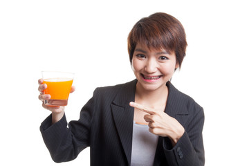 Wall Mural - Young Asian woman point to orange juice.