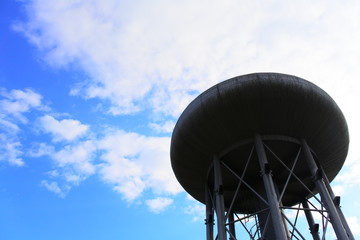 Water tank under the blue sky of Tower buildings