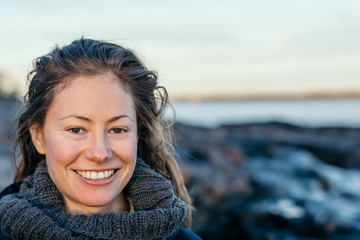 Wall Mural - young woman portrait at the beach with hair down