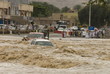 © robertharding - A flash flood in the wadi through the centre of town, Nizwa, Oman