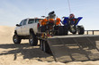 © MDBPIXS - Quad bikes on trailer behind pickup truck in desert