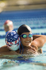 Female participating embracing each other in pool