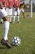 © moodboard - Low section of a football player taking freekick with oppositions in the background