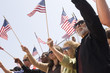© moodboard - Multiethnic group of people with American flag during a rally