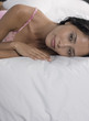 © MDBPIXS - Portrait of sexy young woman lying down in bed