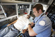 © moodboard - Male EMT professional taking pulse of a man inside ambulance