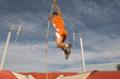 © moodboard - Male athlete pole vaulting against cloudy sky
