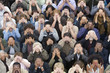 © moodboard - High angle view of multiethnic people covering eyes with hands