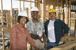 © MDBPIXS - Portrait of three architects with blueprint at construction site